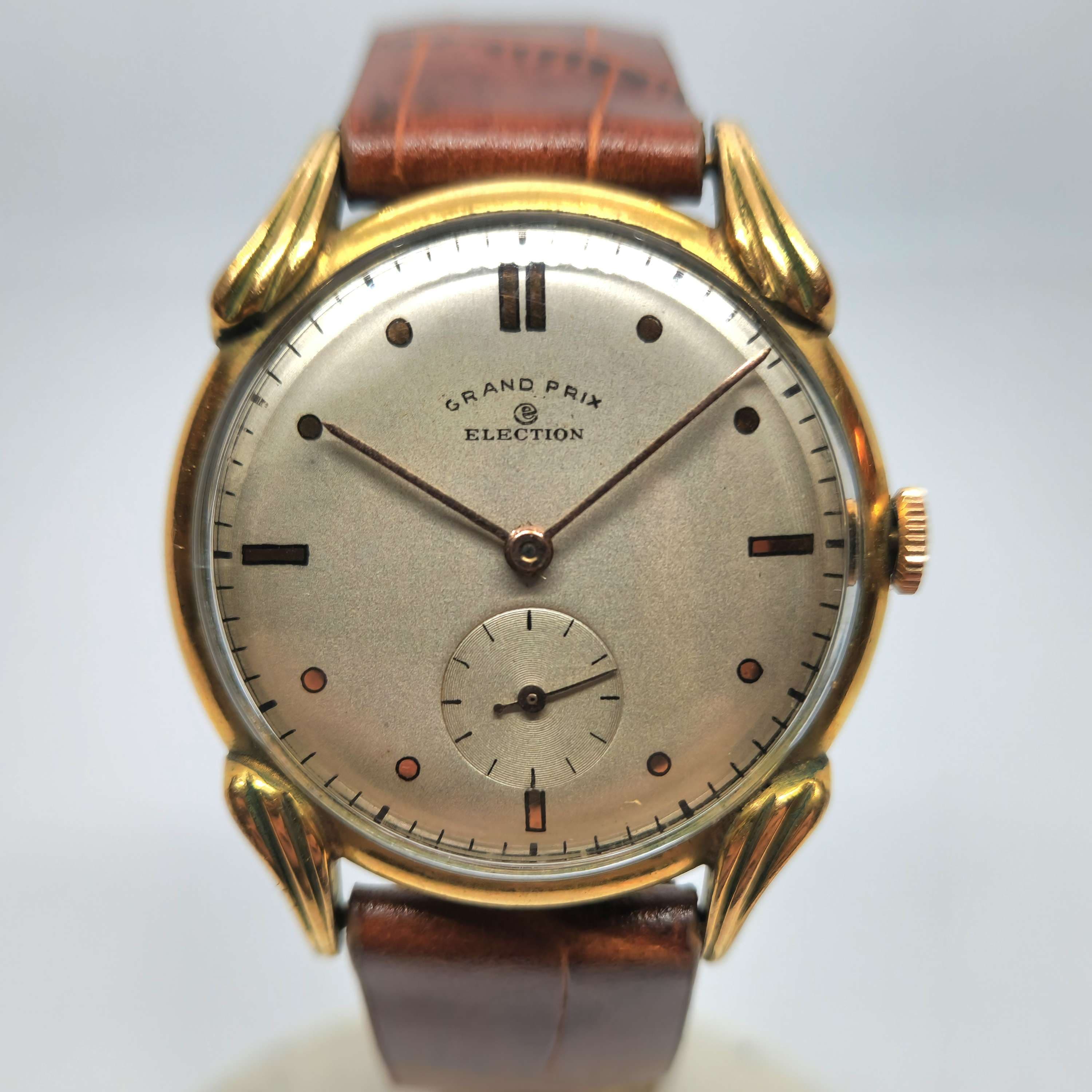 Reloj vintage Election Grand Prix enchapado en oro con segundero auxiliar y correa de cuero marrón en Joyería Recoleta