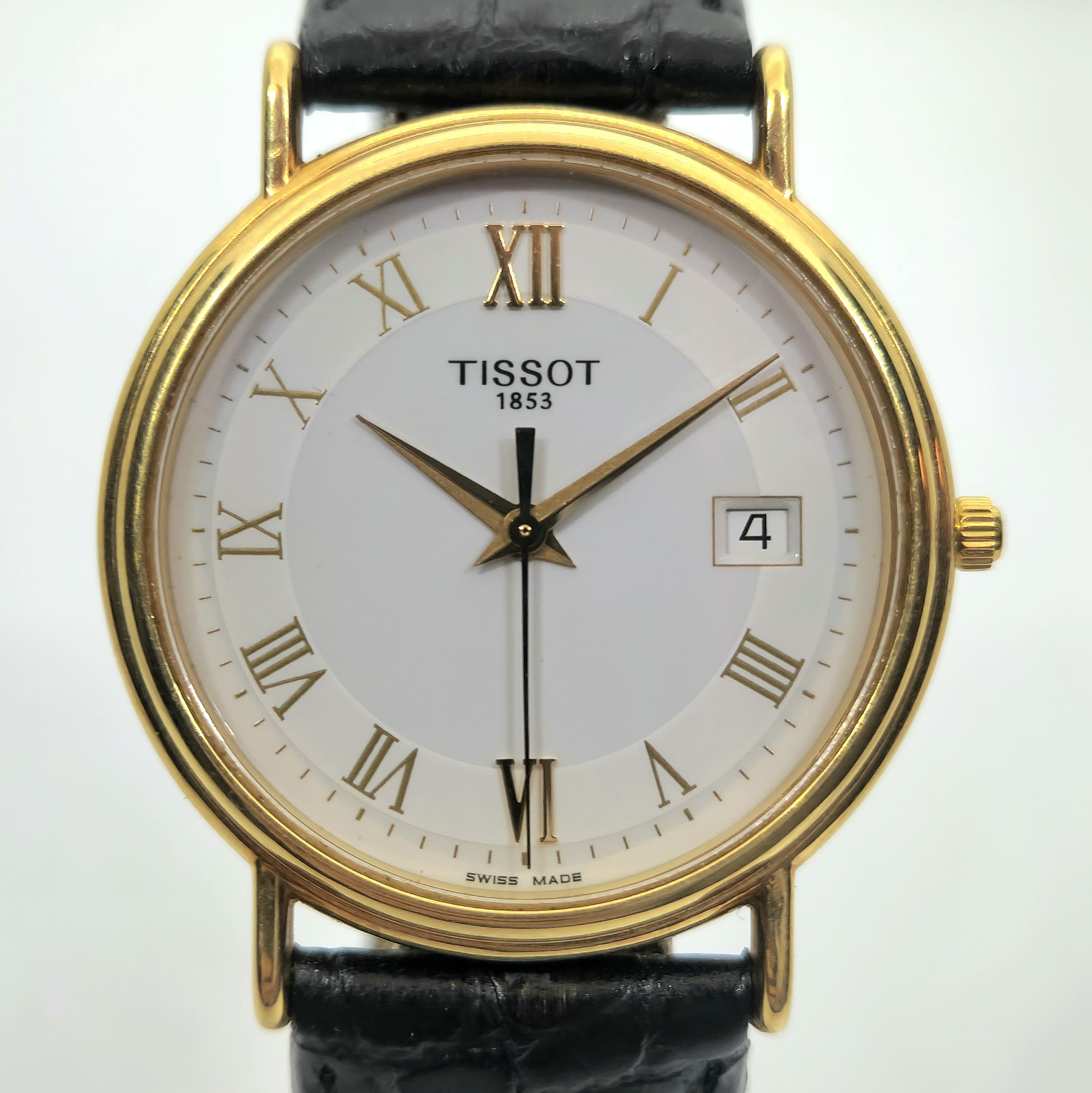 Reloj Tissot 1853 vintage caja dorada números romanos correa cuero negro en Joyería Recoleta