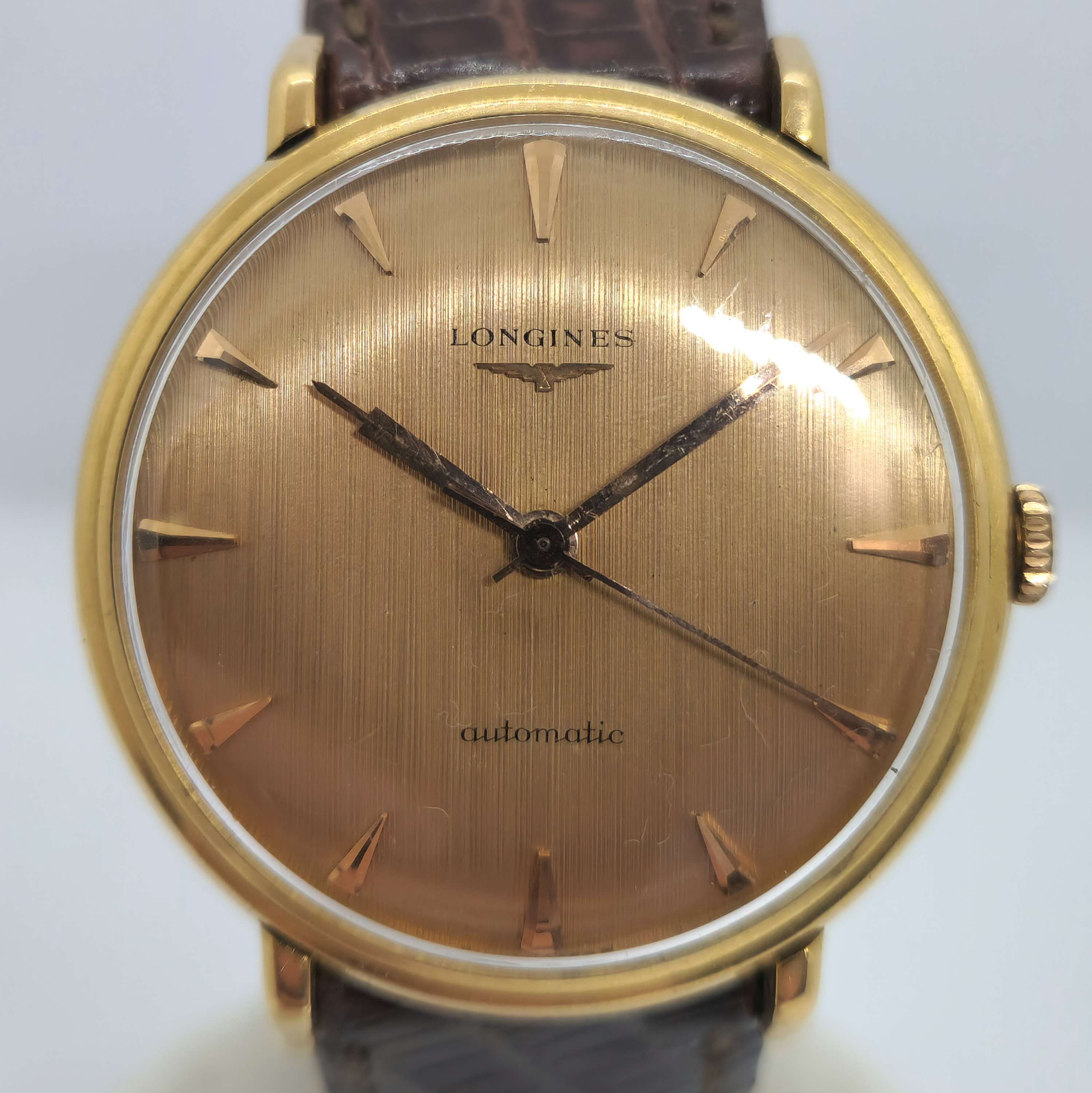 Reloj Longines automático vintage en oro rosa con esfera texturada y correa de cuero marrón en Joyería Recoleta