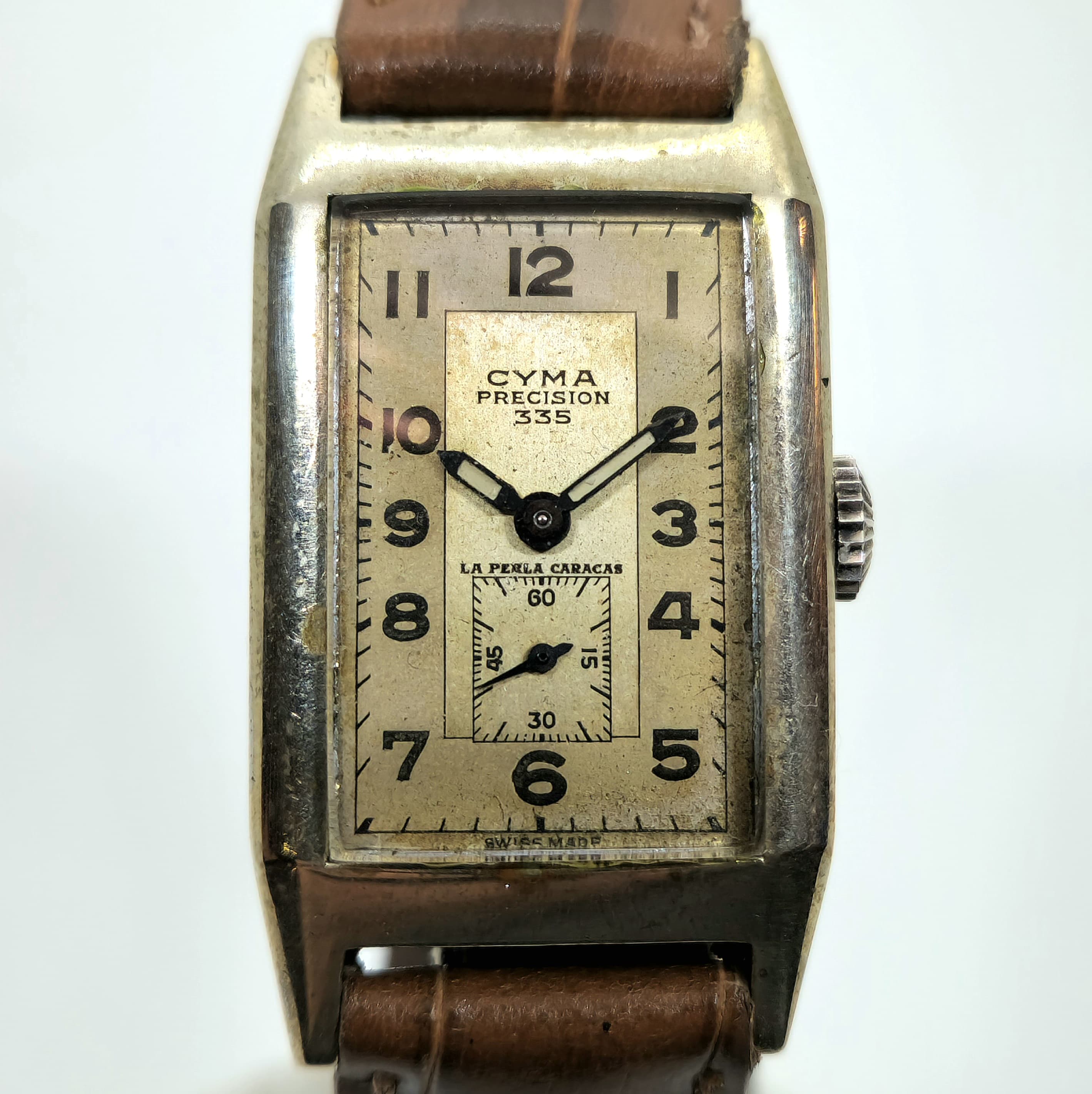 Reloj vintage Cyma Precision 335 acero plateado esfera crema La Perla Caracas en Joyería Recoleta