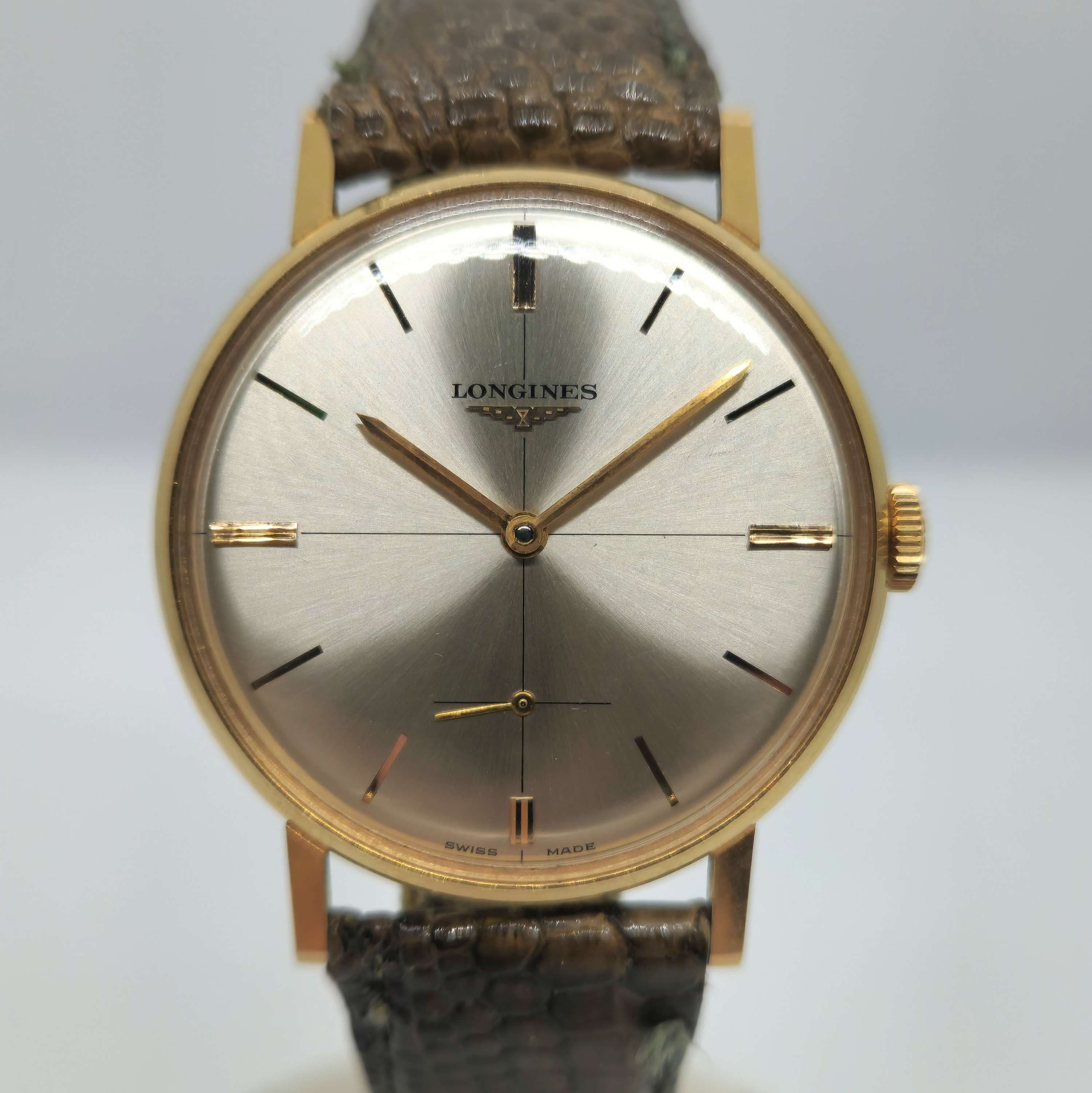 Reloj Longines vintage años 60 en oro amarillo con esfera plateada y correa de cuero en Joyería Recoleta